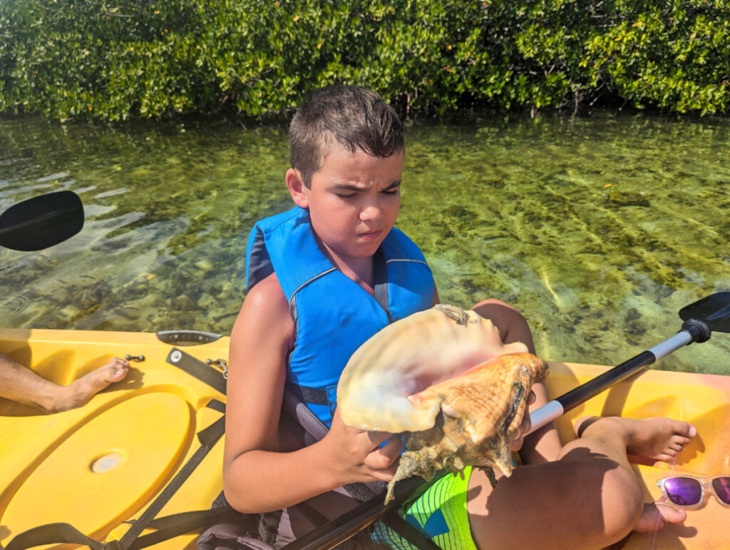 Taylor Family with conch on guided kayak tour with Geiger Key Paddle Hut Key West Florida Keys 1