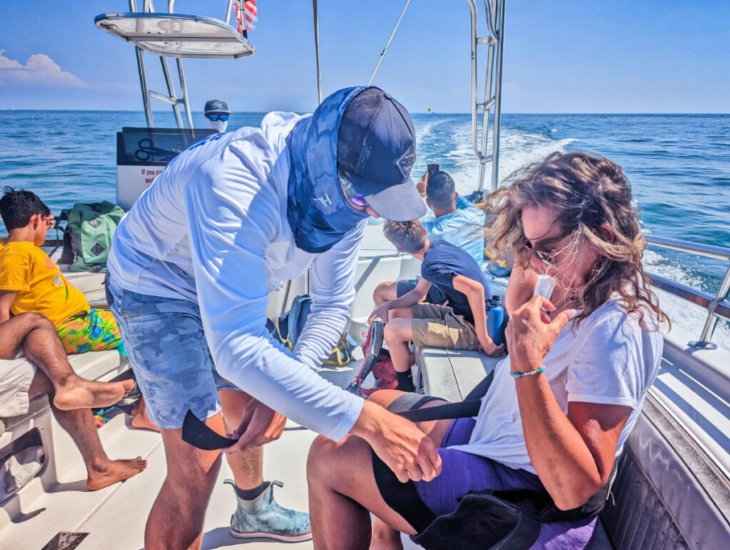 Suiting up for Sebago Watersports Parasail in Historic Seaport Key West Florida Keys 1